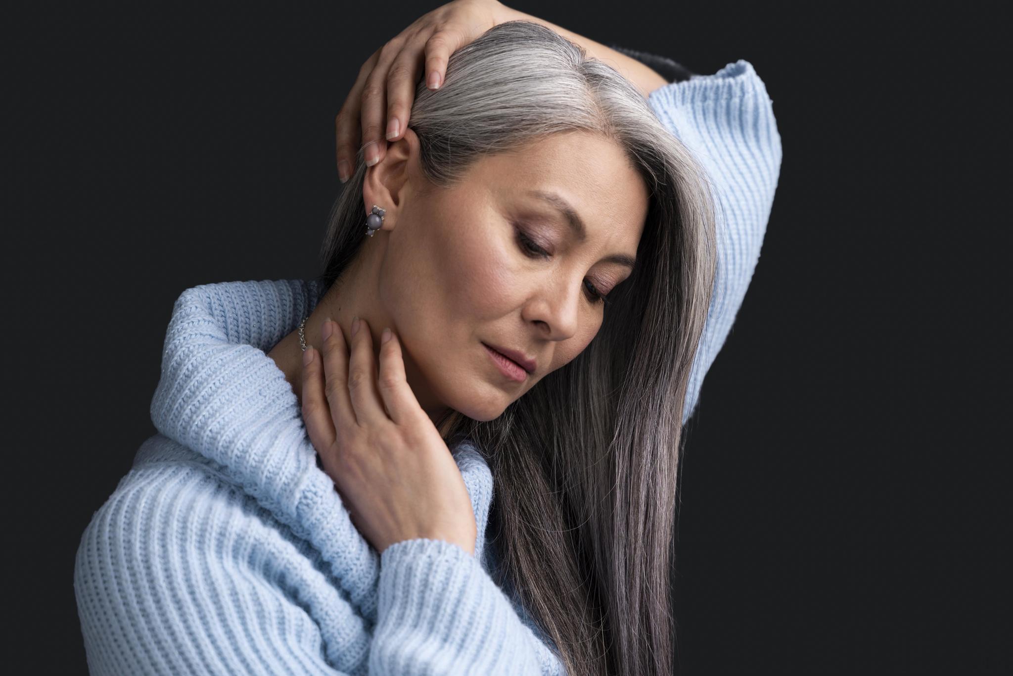 Woman embracing her grey hair
